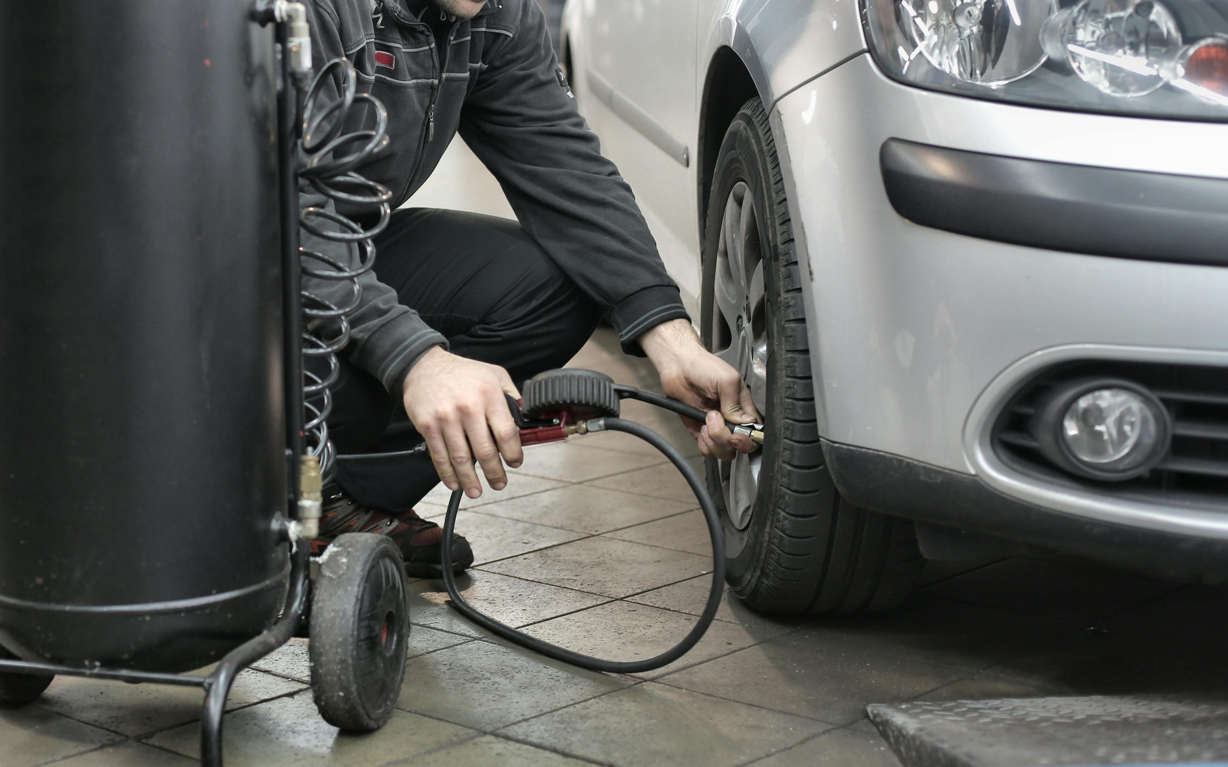 Pumping up car tyre