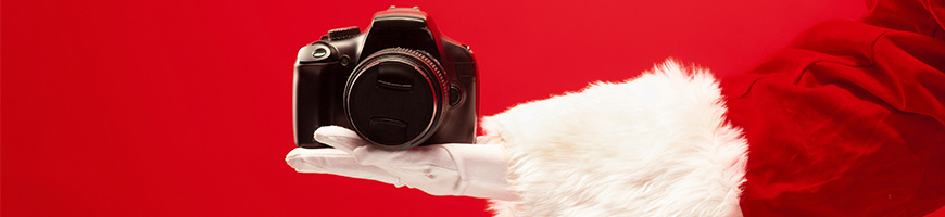 Father Christmas holding a camera