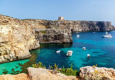 Gozo, rocks overlooking blue lagoon 