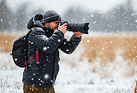 Man photographing snow