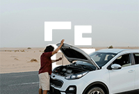 Man on the phone looking into open car bonnet with Eversure logo