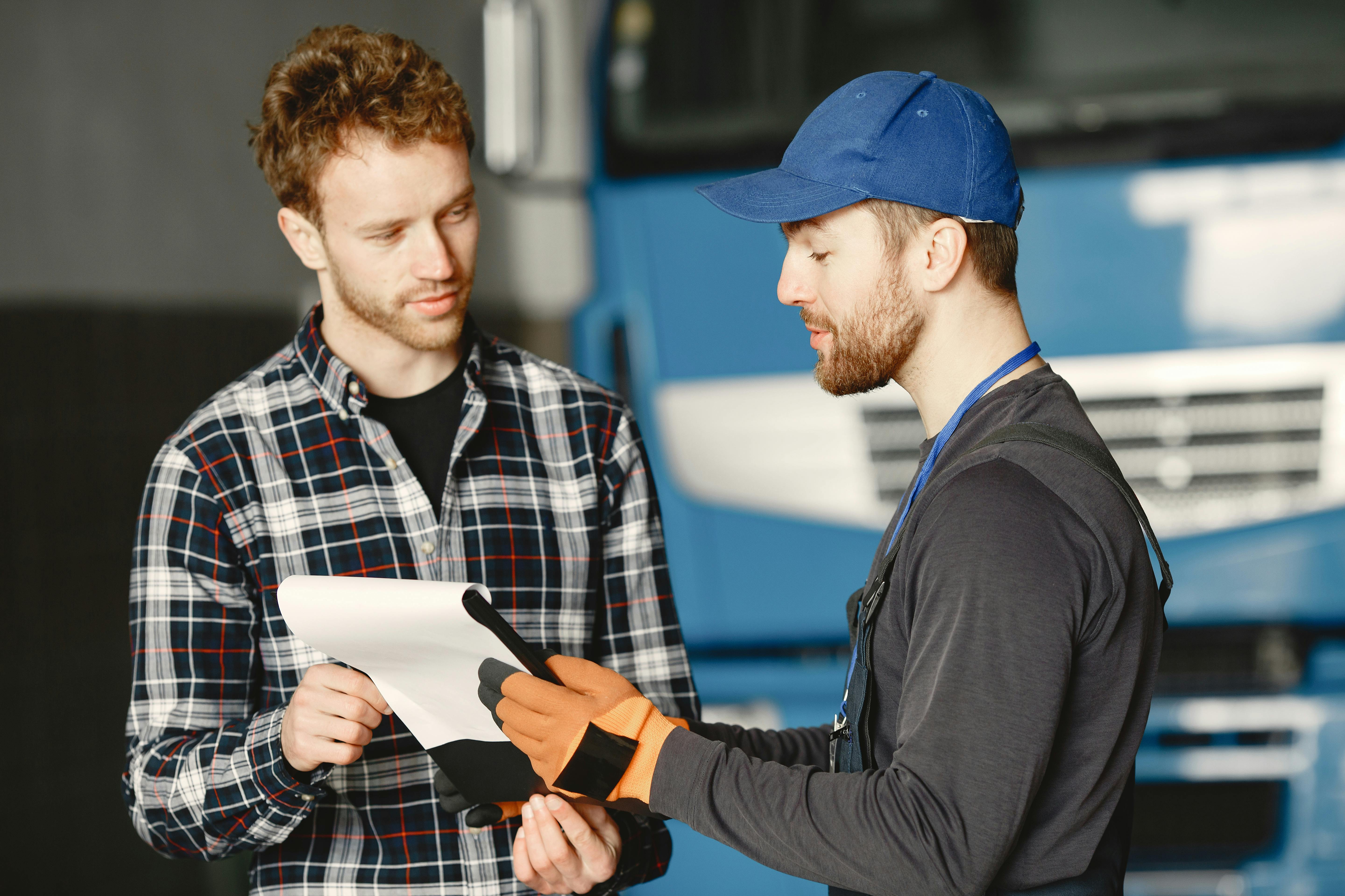 Two men discussing a car service